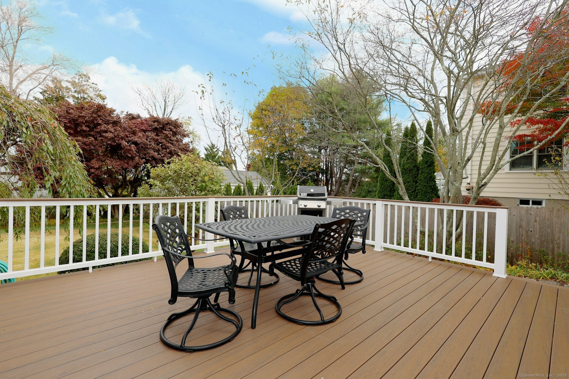 100 Overhill Road Fairfield, CT 06824 - Photo 21 of 40 a view of a deck with furniture and wooden floor