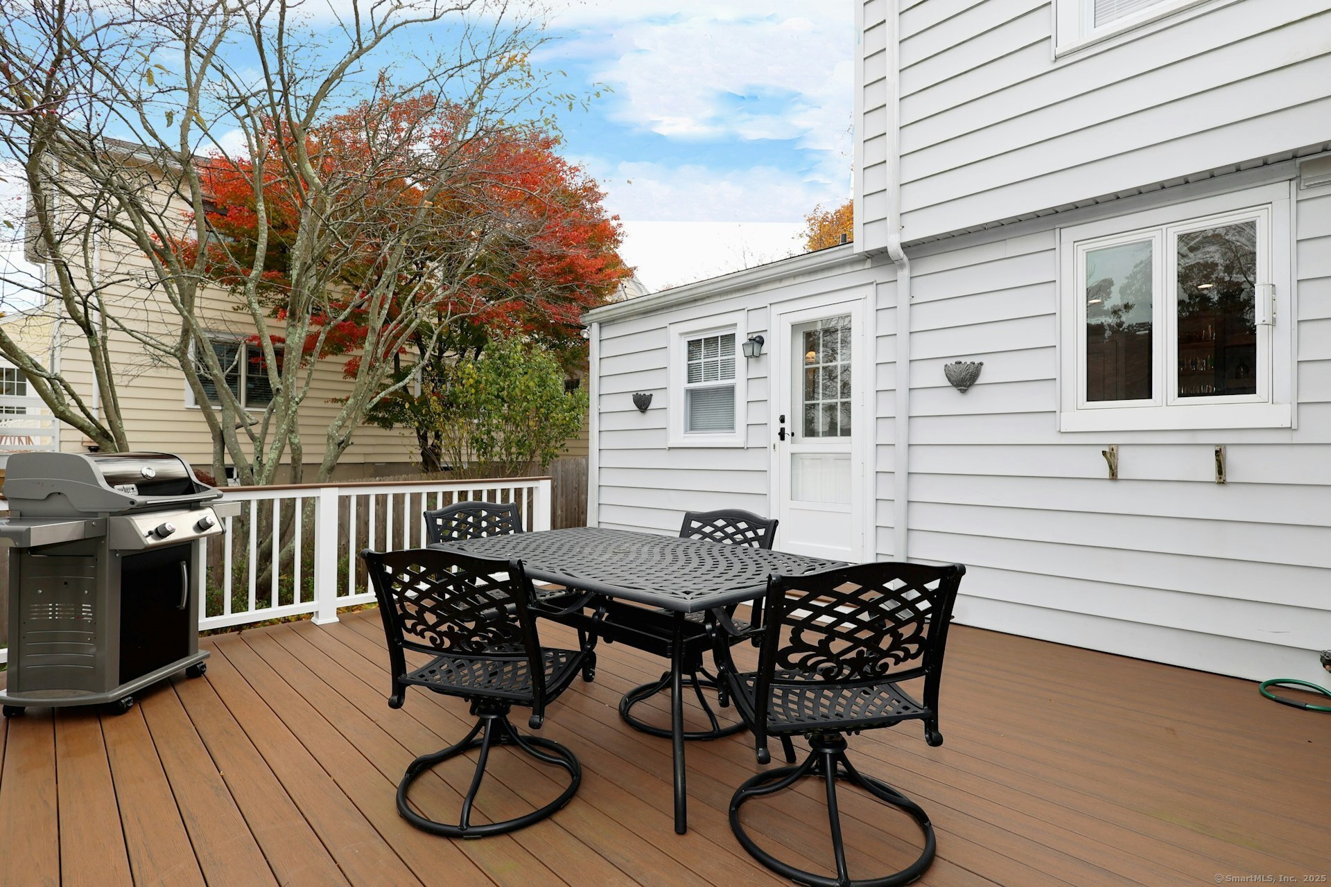 100 Overhill Road Fairfield, CT 06824 - Photo 22 of 40 a view of a chairs and table on the deck