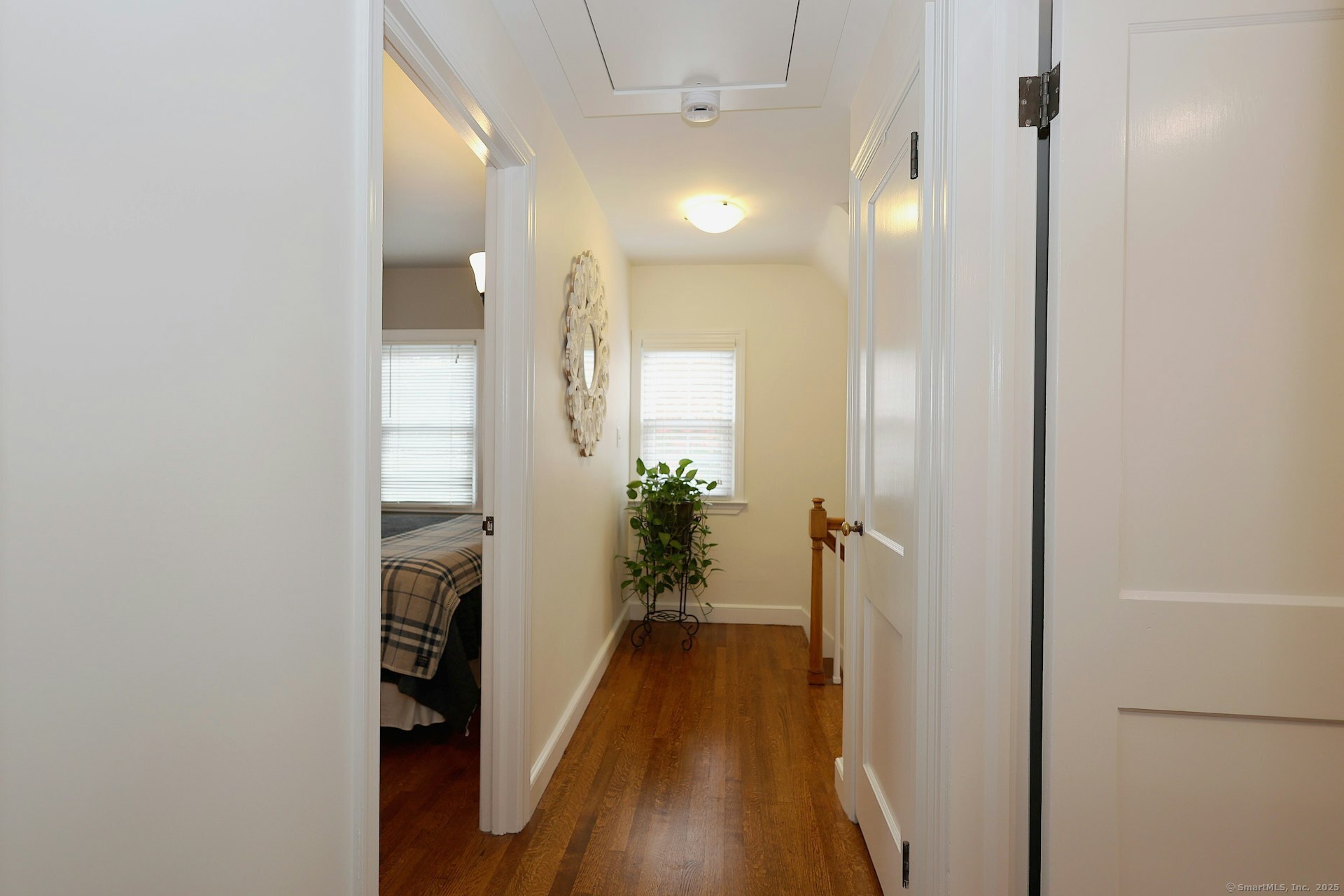 100 Overhill Road Fairfield, CT 06824 - Photo 26 of 40 a view of a hallway with wooden floor and a bathroom