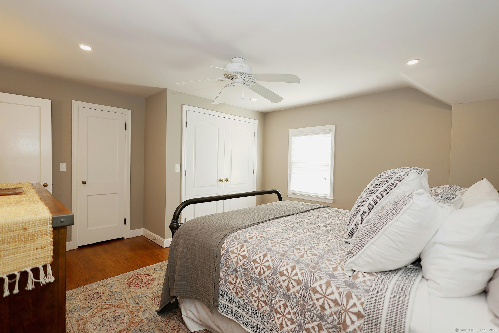 100 Overhill Road Fairfield, CT 06824 - Photo 28 of 40 a bedroom with a bed and wooden floor