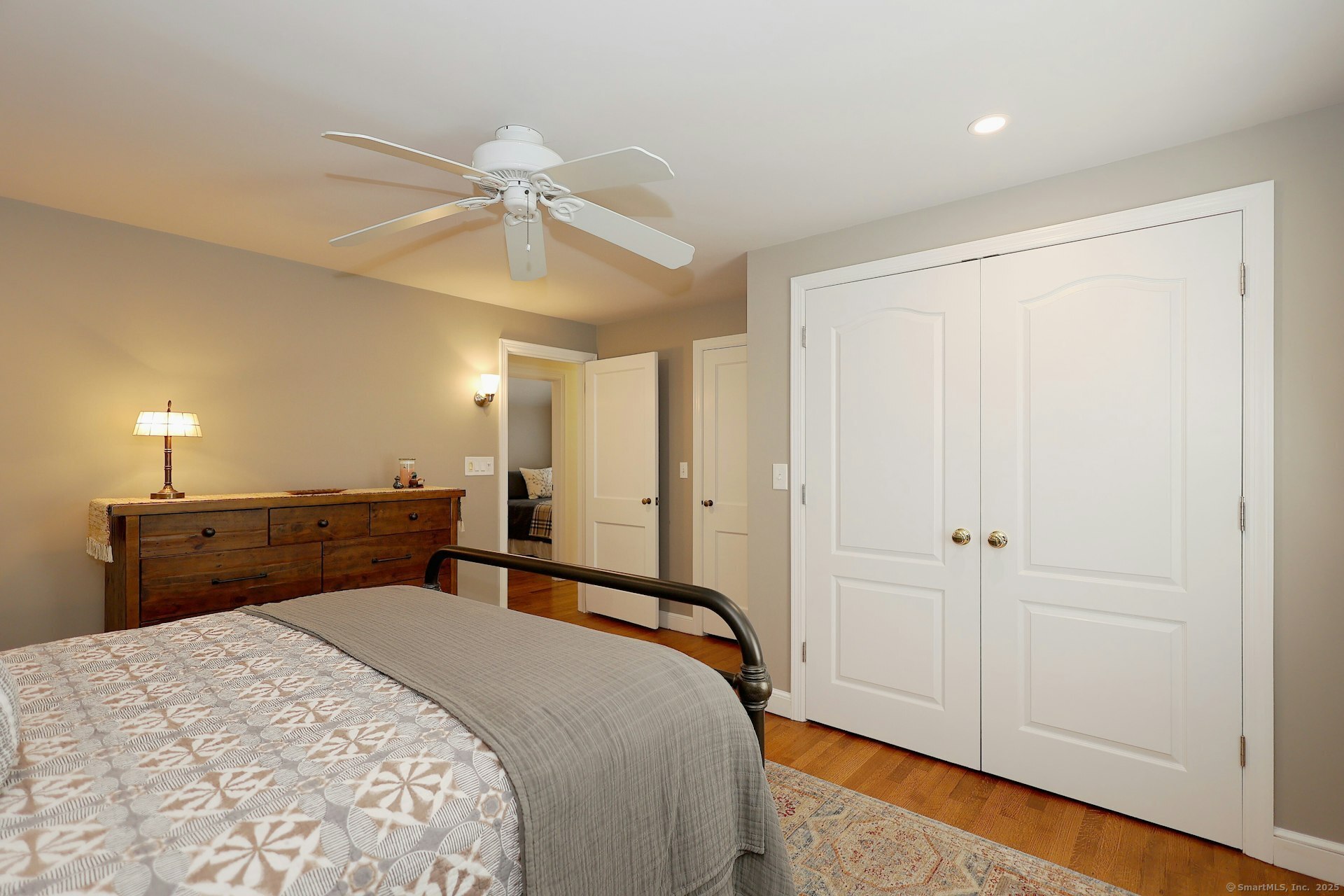 100 Overhill Road Fairfield, CT 06824 - Photo 29 of 40 a bedroom with a bed and a chandelier