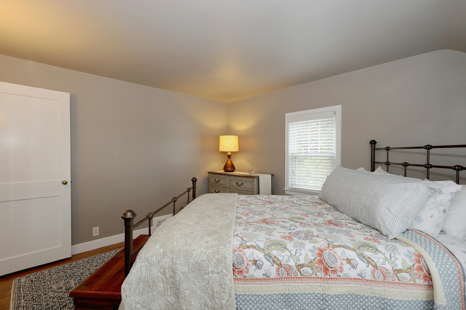 100 Overhill Road Fairfield, CT 06824 - Photo 34 of 40 a bedroom with a bed and wooden floor