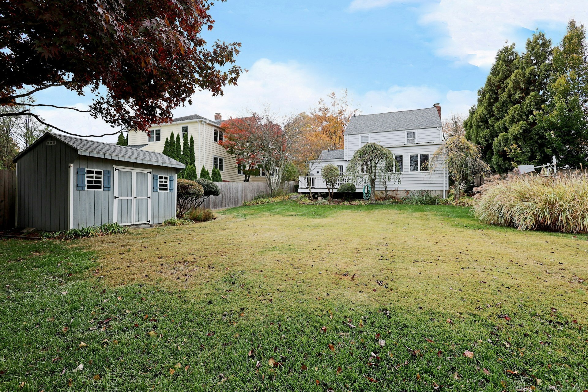 100 Overhill Road Fairfield, CT 06824 - Photo 38 of 40 a view of a house with a big yard and large trees
