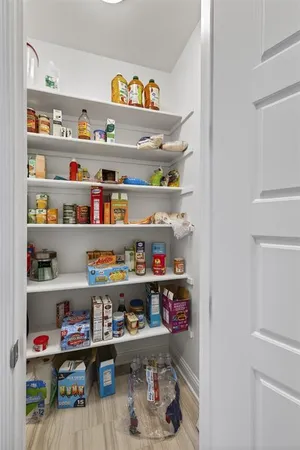 a shelf with cup and plates