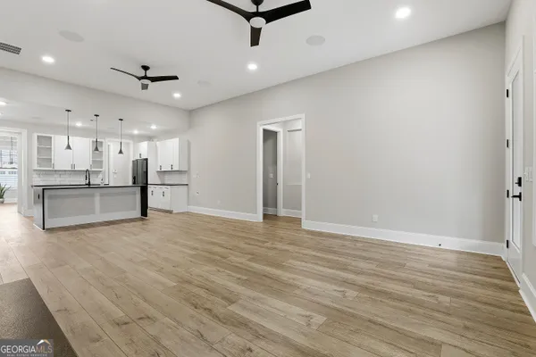 a kitchen with granite countertop a stove and a sink