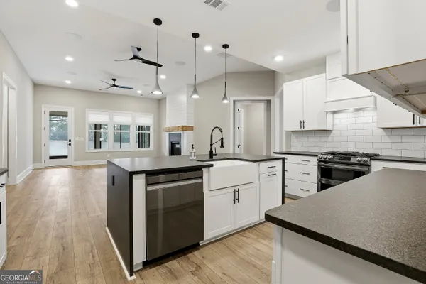 a kitchen with a sink and cabinets