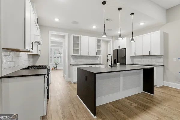 a bathroom with a double sink shower double vanity and a shower