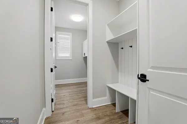 a bathroom with a double vanity sink mirror and a bathtub