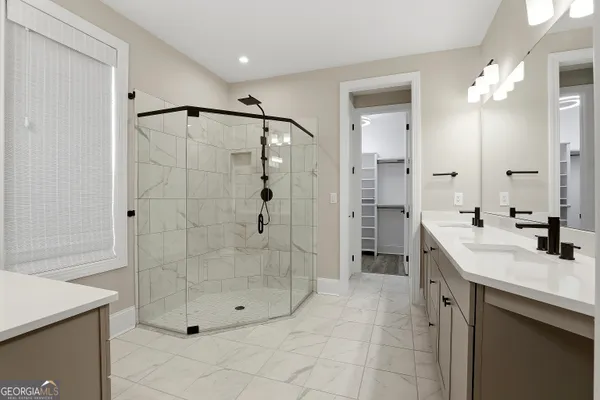 a bed room with a bed and a tv