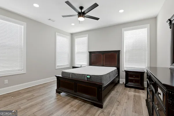 a en suite bathroom with a sink a toilet and a mirror