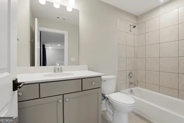 a view of a patio with table and chairs and potted plants