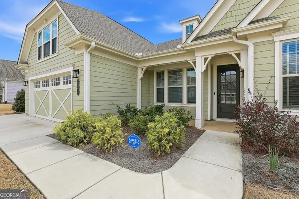 wooden view of a hallway with wooden floor and closet area