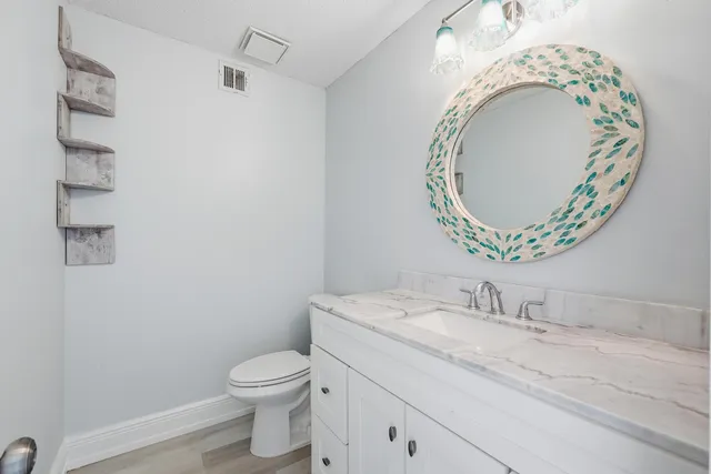 a living room with a fireplace and a flat screen tv