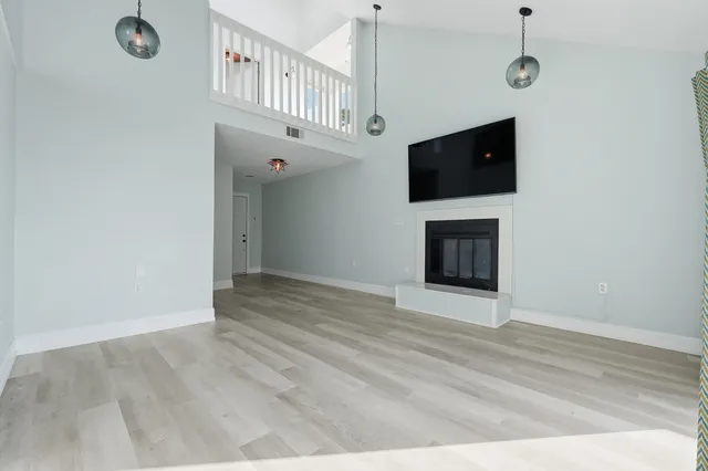 a kitchen with stainless steel appliances granite countertop a refrigerator a stove and a sink