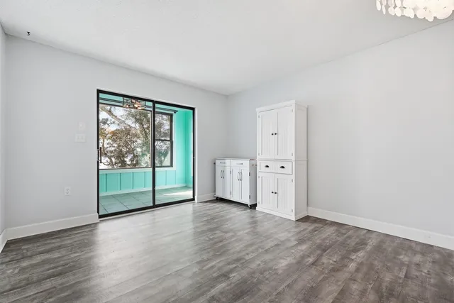 a kitchen with stainless steel appliances granite countertop a sink and a refrigerator