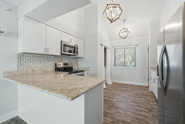 a view of wooden floor and a window
