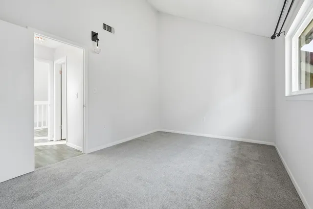 a bathroom with a toilet and a bath tub
