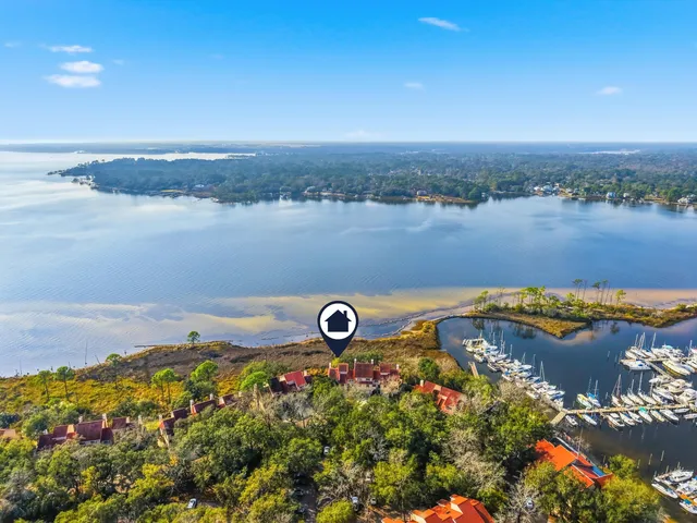 an aerial view of residential house with swimming pool and outdoor seating