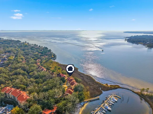 a front view of a residential apartment building with a yard