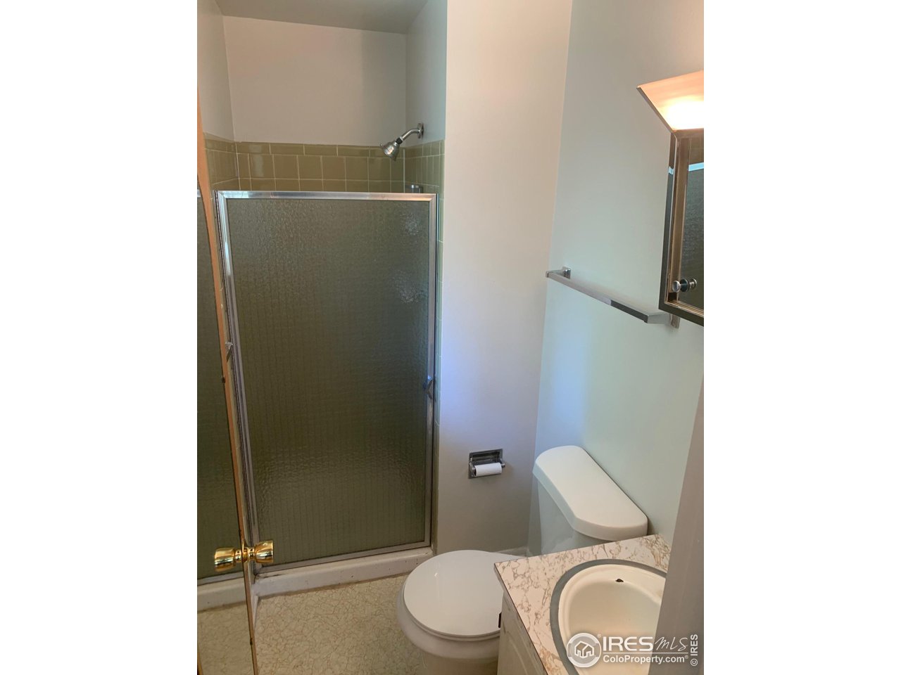 3310 Everett Drive Boulder, CO 80305 - Photo 11 of 17 a bathroom with a toilet and a shower