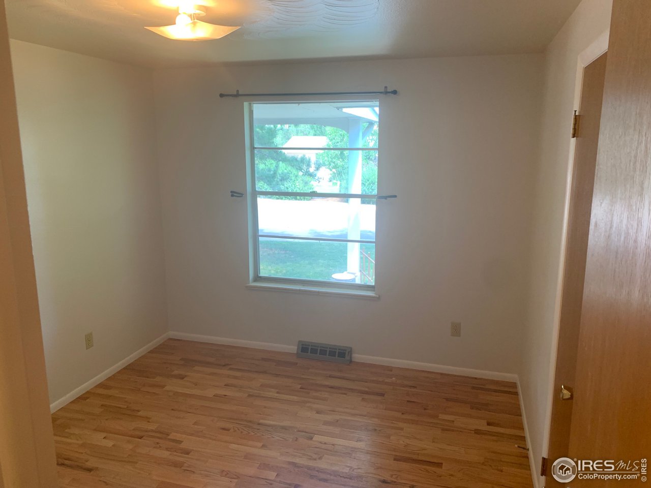 3310 Everett Drive Boulder, CO 80305 - Photo 13 of 17 a view of empty room with wooden floor and fan