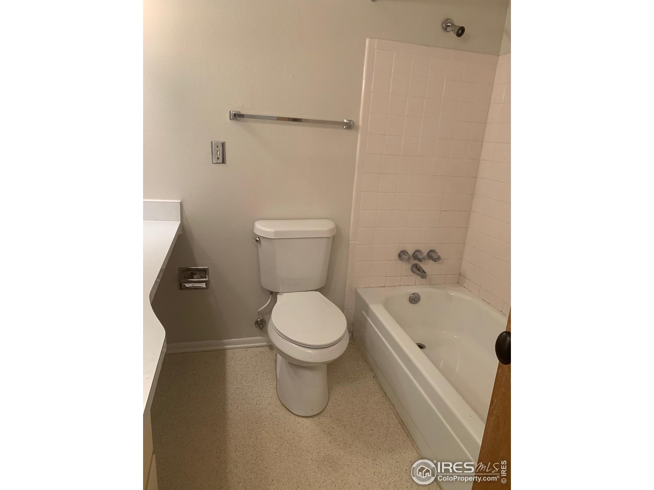 3310 Everett Drive Boulder, CO 80305 - Photo 15 of 17 a white toilet sitting next to a bathroom sink and a shower
