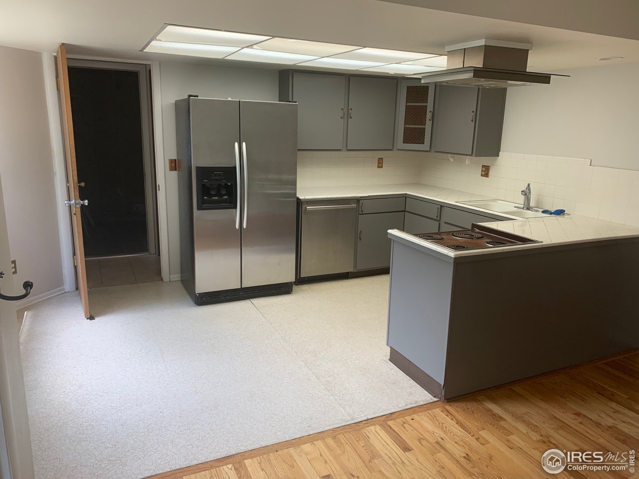 3310 Everett Drive Boulder, CO 80305 - Photo 5 of 17 a kitchen with stainless steel appliances granite countertop a sink and a refrigerator