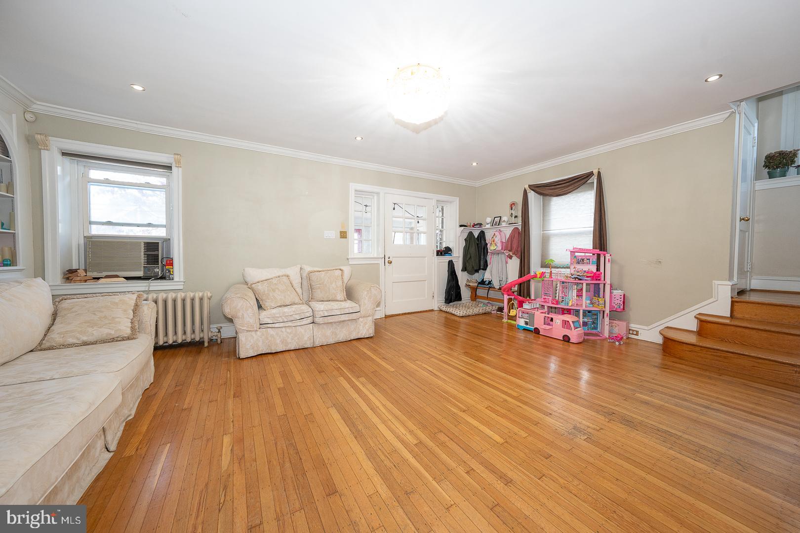 122 Crestview Road Upper Darby, PA 19082 - Photo 11 of 46 a living room with furniture and a wooden floor