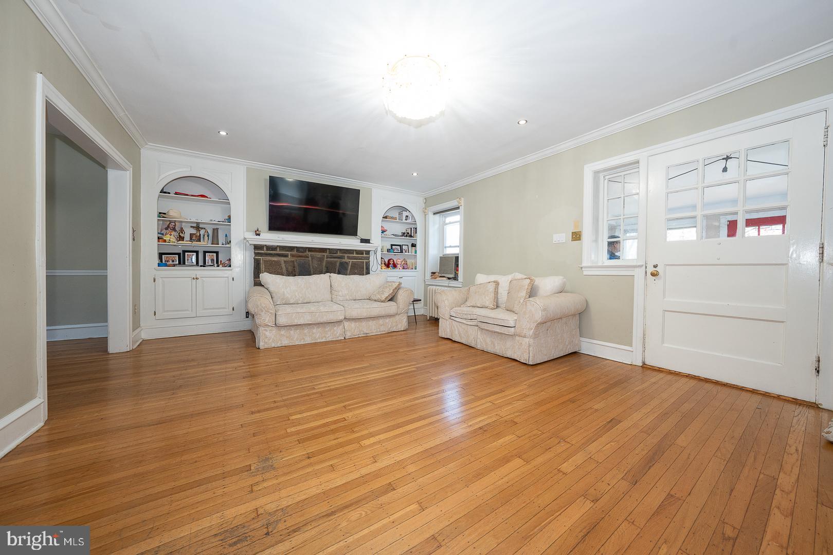 122 Crestview Road Upper Darby, PA 19082 - Photo 12 of 46 a living room with furniture and a flat screen tv