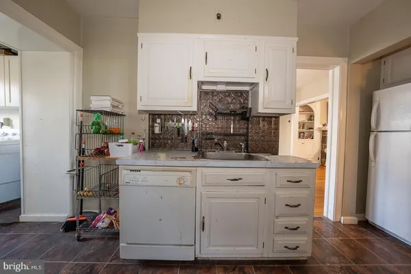 a room with furniture a rug and a closet