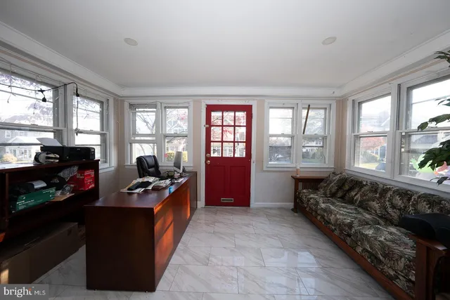 a large living room with furniture and a windows