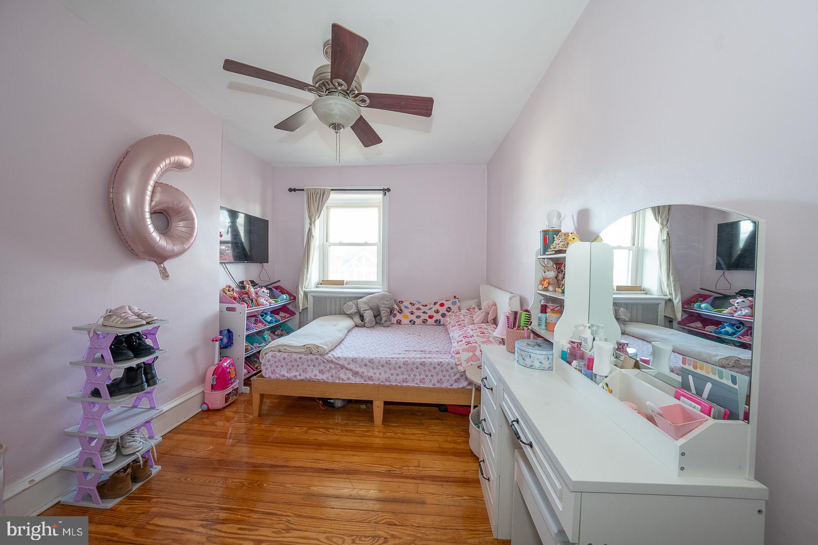 122 Crestview Road Upper Darby, PA 19082 - Photo 23 of 46 a bedroom with a bed and a chandelier