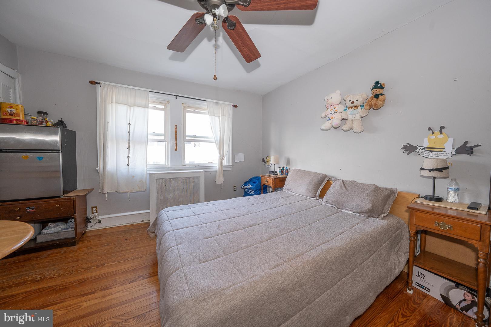 122 Crestview Road Upper Darby, PA 19082 - Photo 25 of 46 a bedroom with a bed and wooden floor