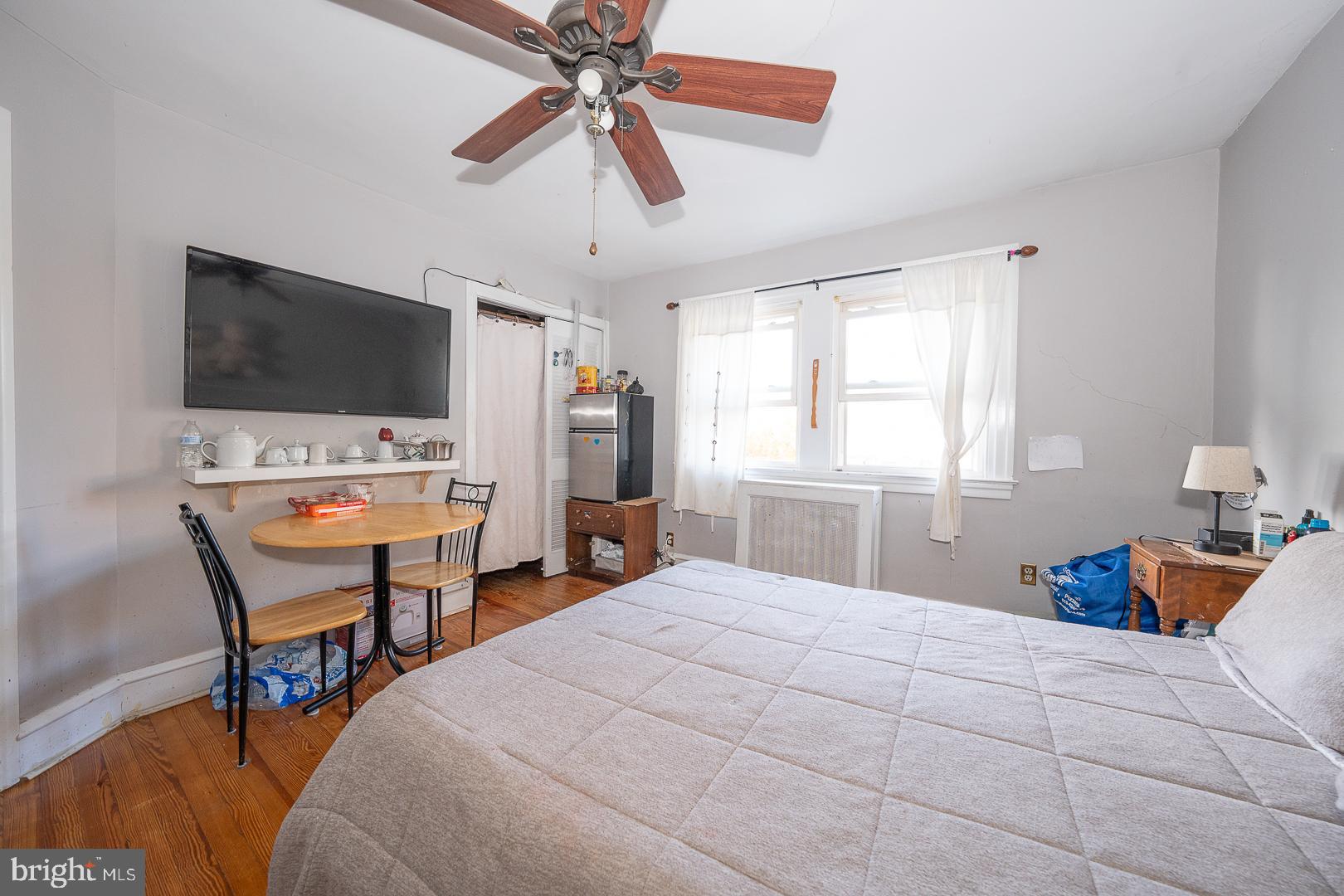 122 Crestview Road Upper Darby, PA 19082 - Photo 26 of 46 a bedroom with a bed and a flat screen tv