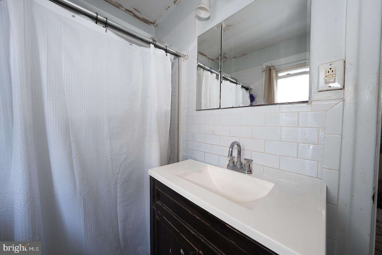122 Crestview Road Upper Darby, PA 19082 - Photo 28 of 46 a bathroom with a sink and a mirror
