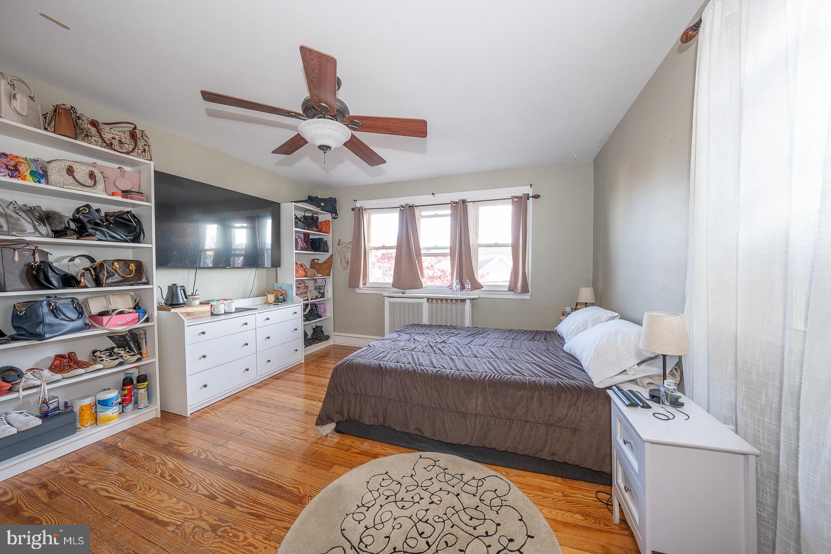 122 Crestview Road Upper Darby, PA 19082 - Photo 31 of 46 a bedroom with a bed cabinets and window
