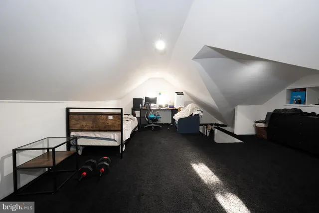 a view of empty room with wooden ceiling