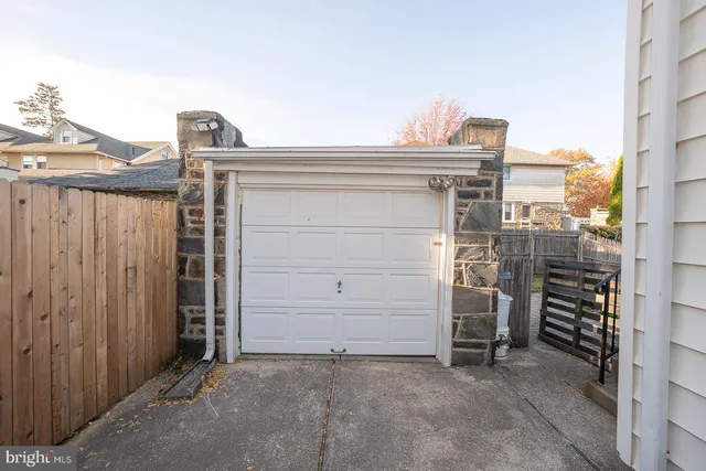 a view of a patio with table and chairs and potted plants