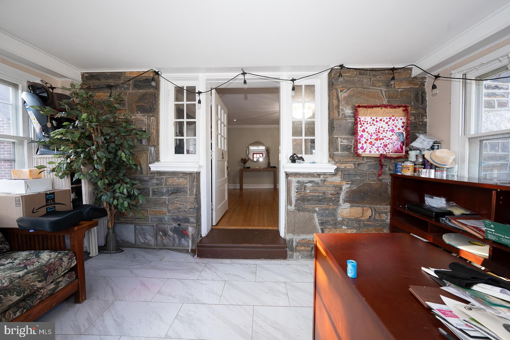 122 Crestview Road Upper Darby, PA 19082 - Photo 4 of 46 a living room with furniture a flat screen tv and a fireplace