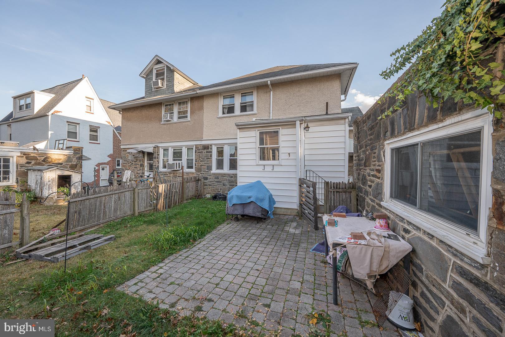 122 Crestview Road Upper Darby, PA 19082 - Photo 42 of 46 a view of a patio with table and chairs and potted plants