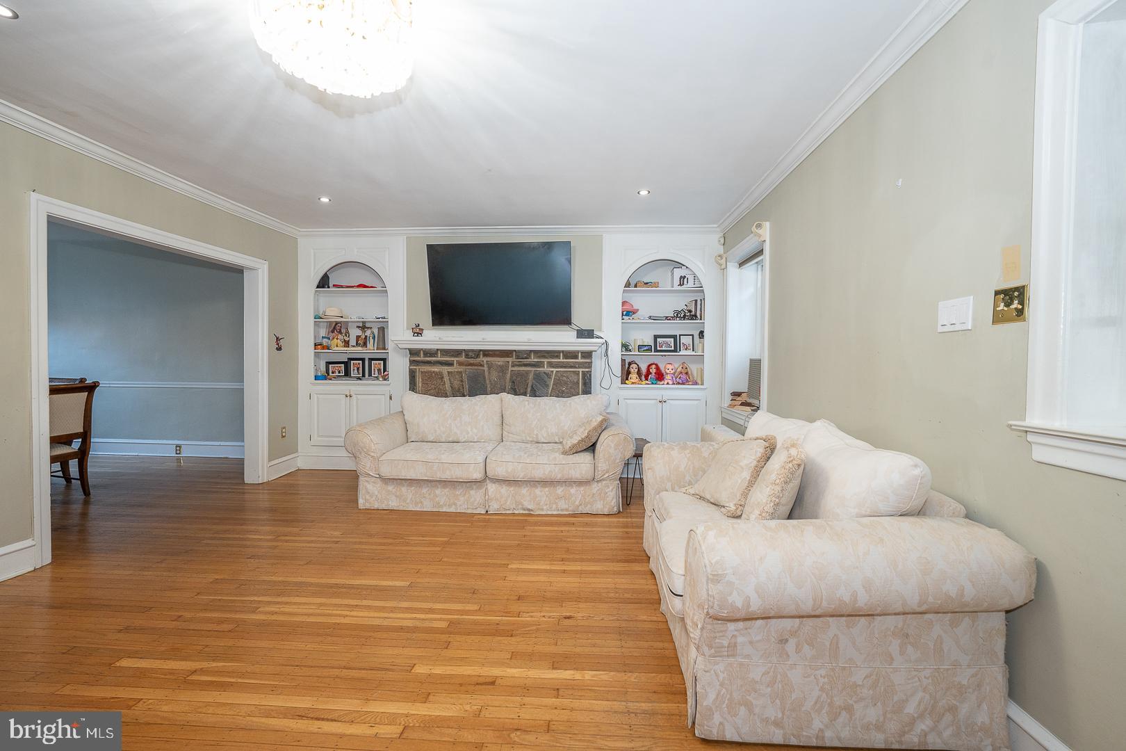 122 Crestview Road Upper Darby, PA 19082 - Photo 7 of 46 a living room with furniture and a flat screen tv