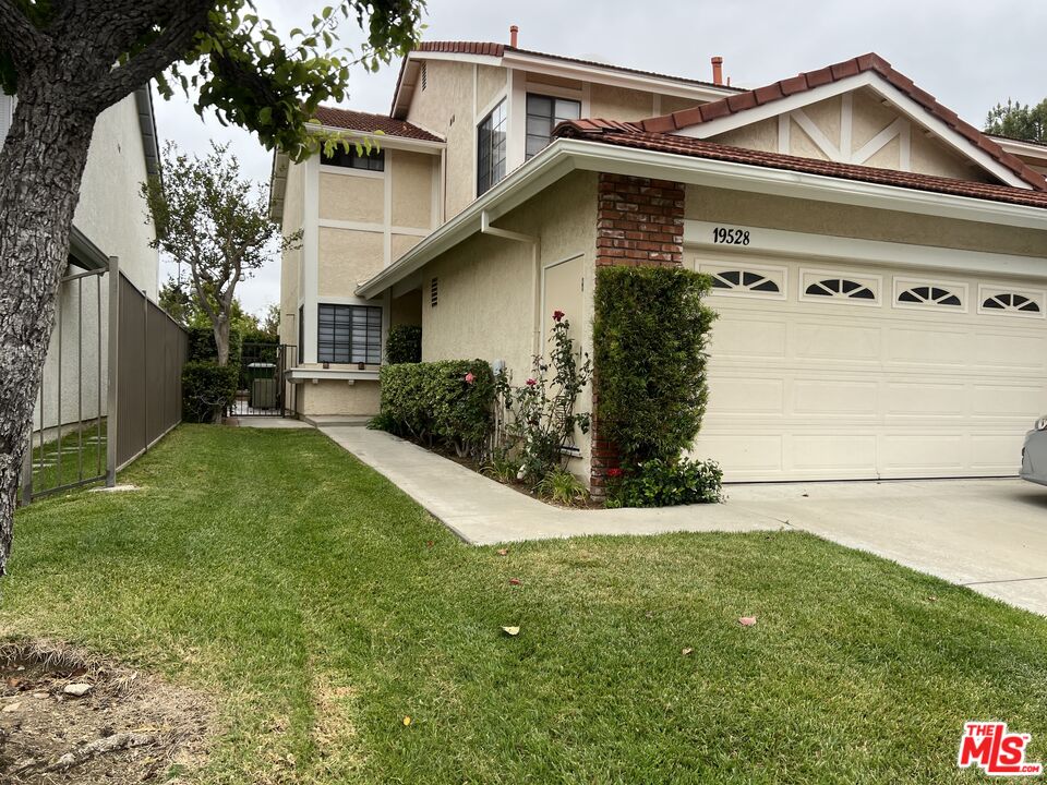 19528 Eagle Ridge Lane Porter Ranch, CA 91326 - Photo 2 of 20 a view of a front of house with a yard