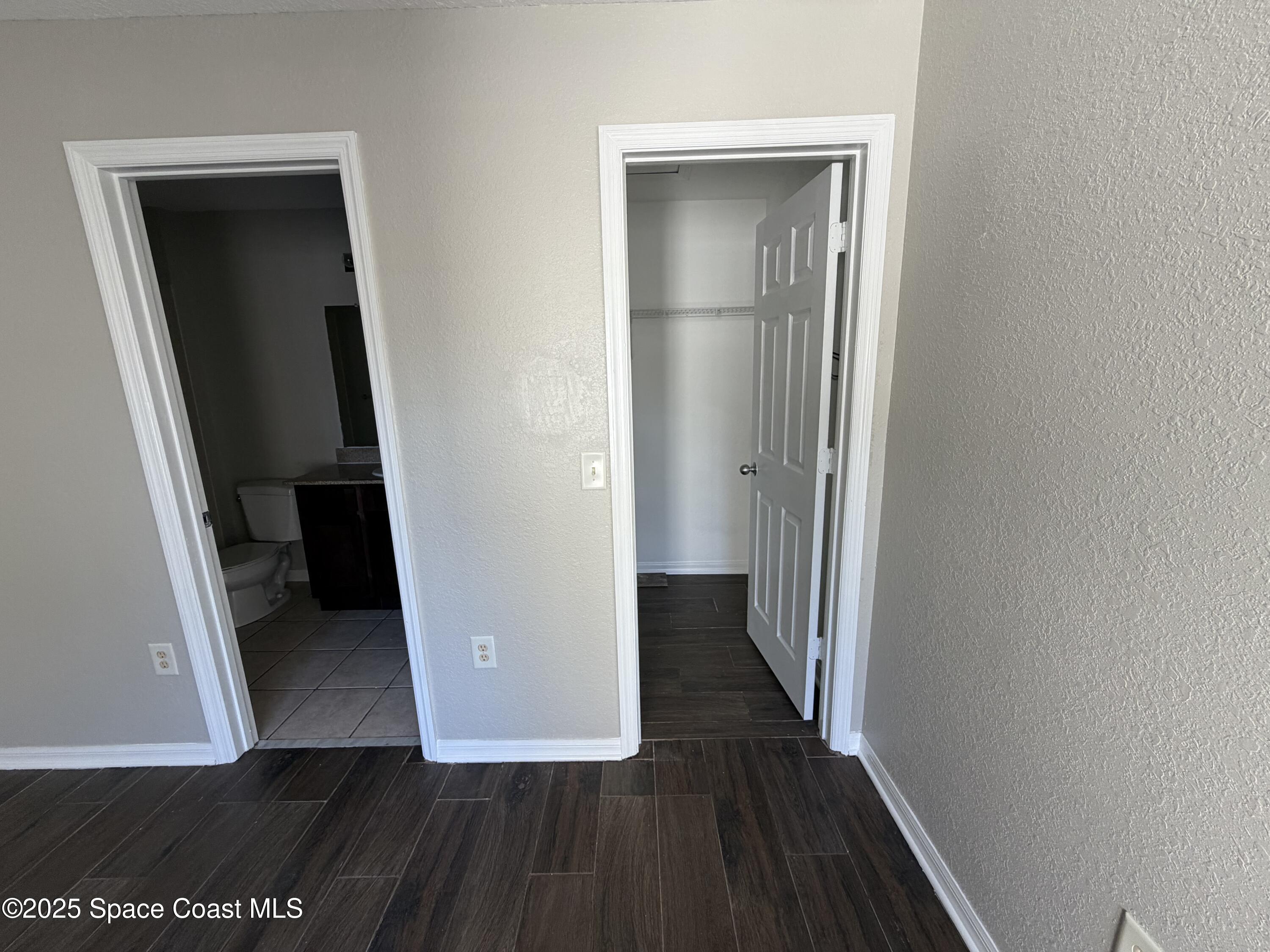 3511 D D'Avinci Way, Unit 2012 Melbourne, FL 32901 - Photo 11 of 26 wooden floor in a gallery