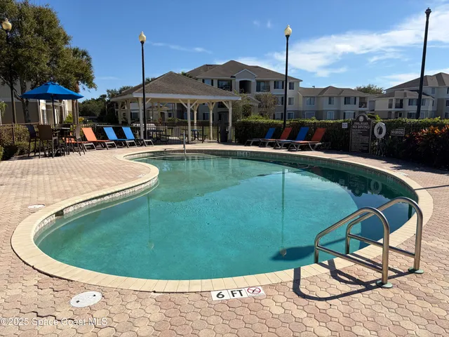 a front view of a house with a yard table and chairs