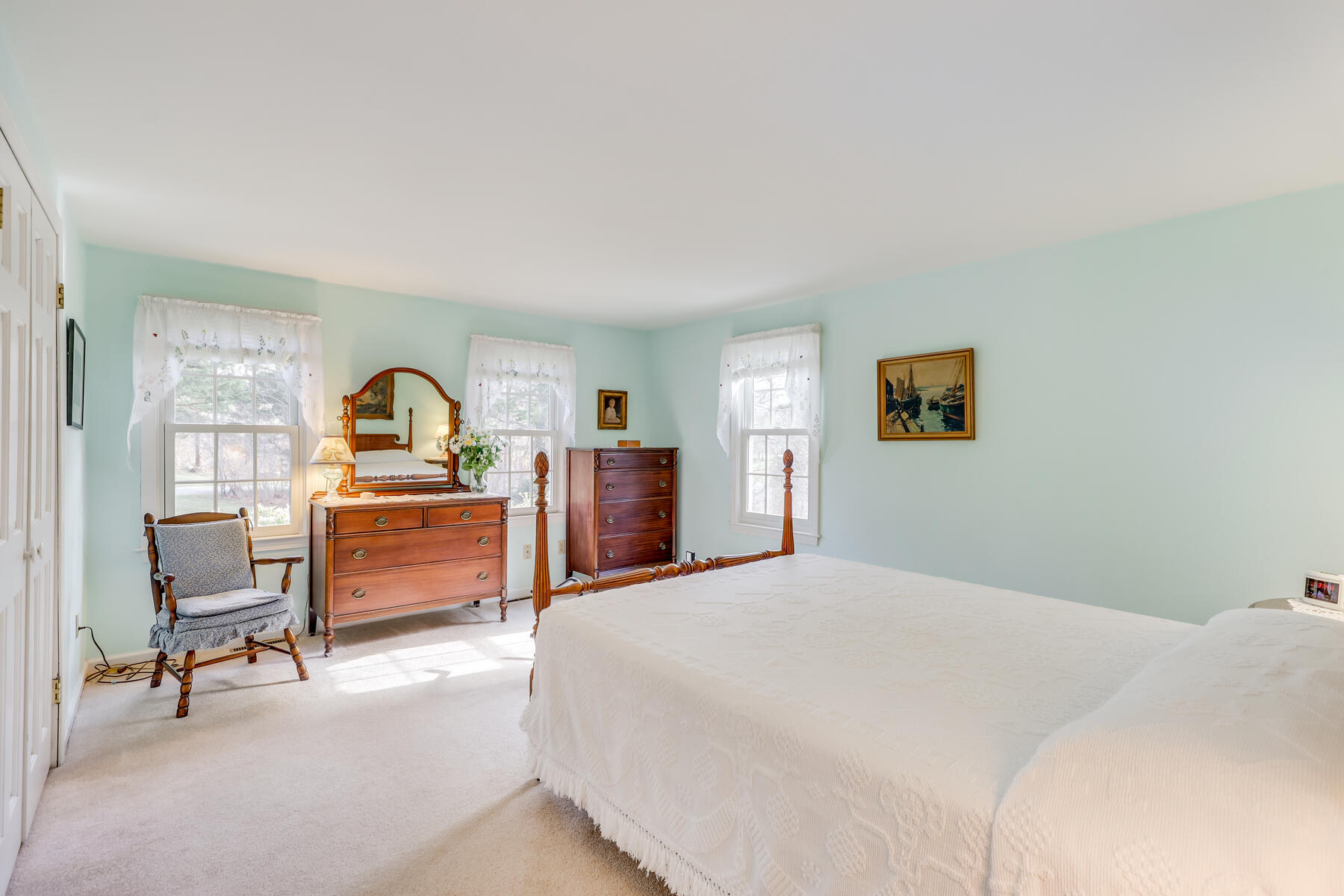 84 Beach Road Orleans, MA 02653 - Photo 13 of 45 a bedroom with a large bed a computer on desk and chair