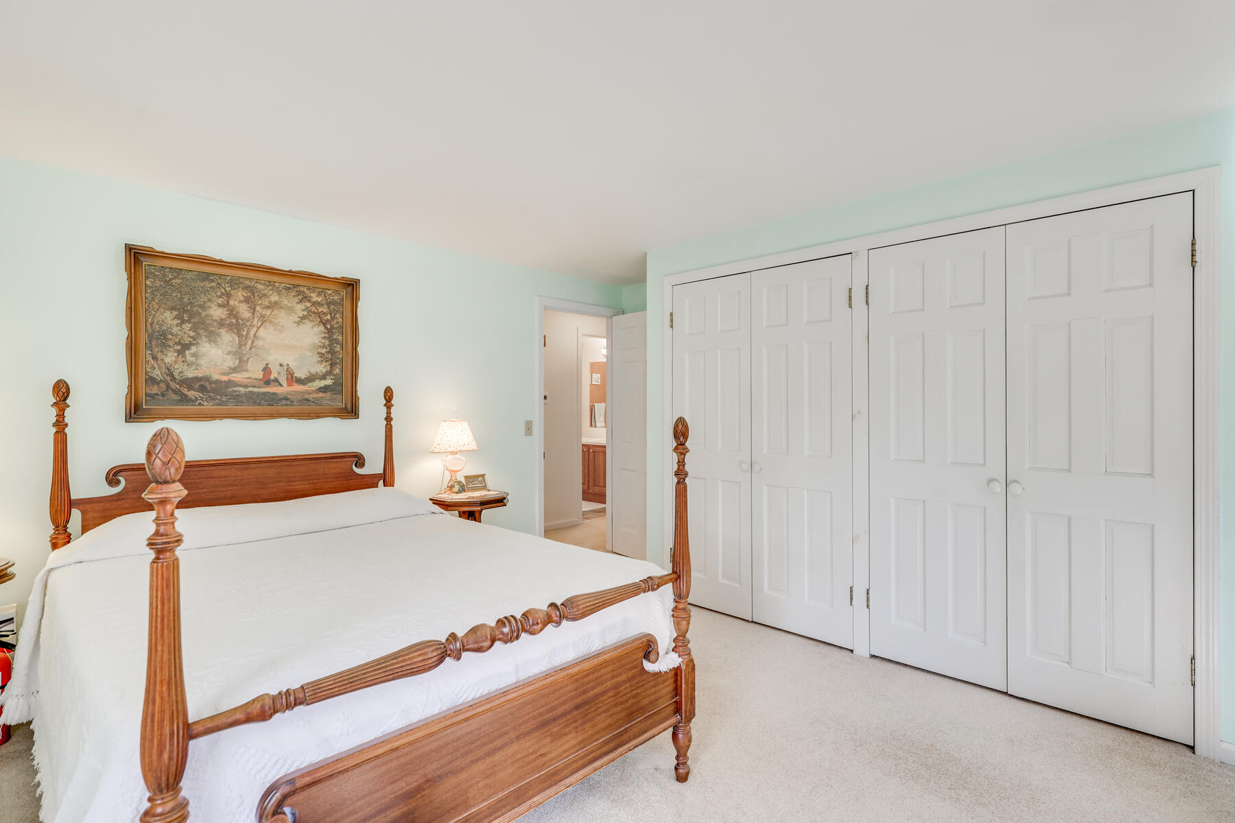 84 Beach Road Orleans, MA 02653 - Photo 14 of 45 a bedroom with a bed and a painting on the wall