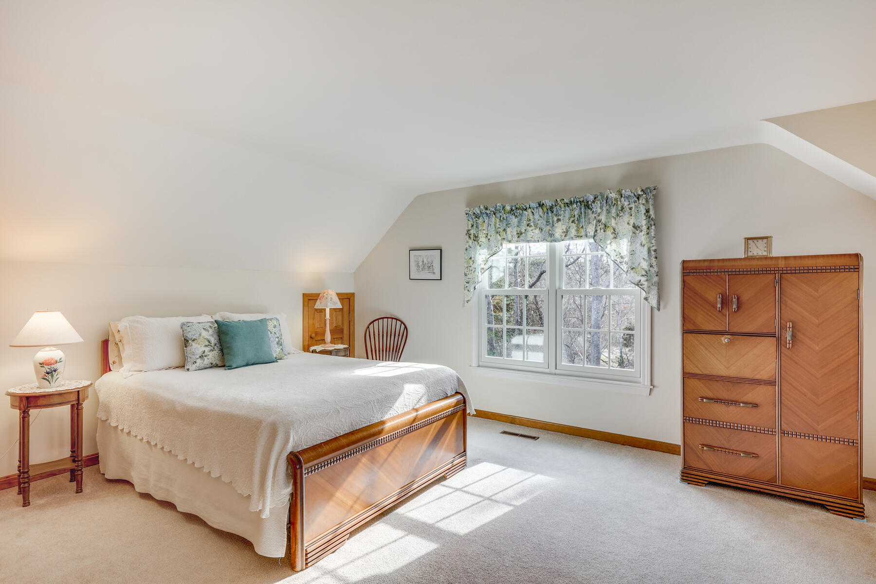 84 Beach Road Orleans, MA 02653 - Photo 19 of 45 a bedroom with a bed and a dresser