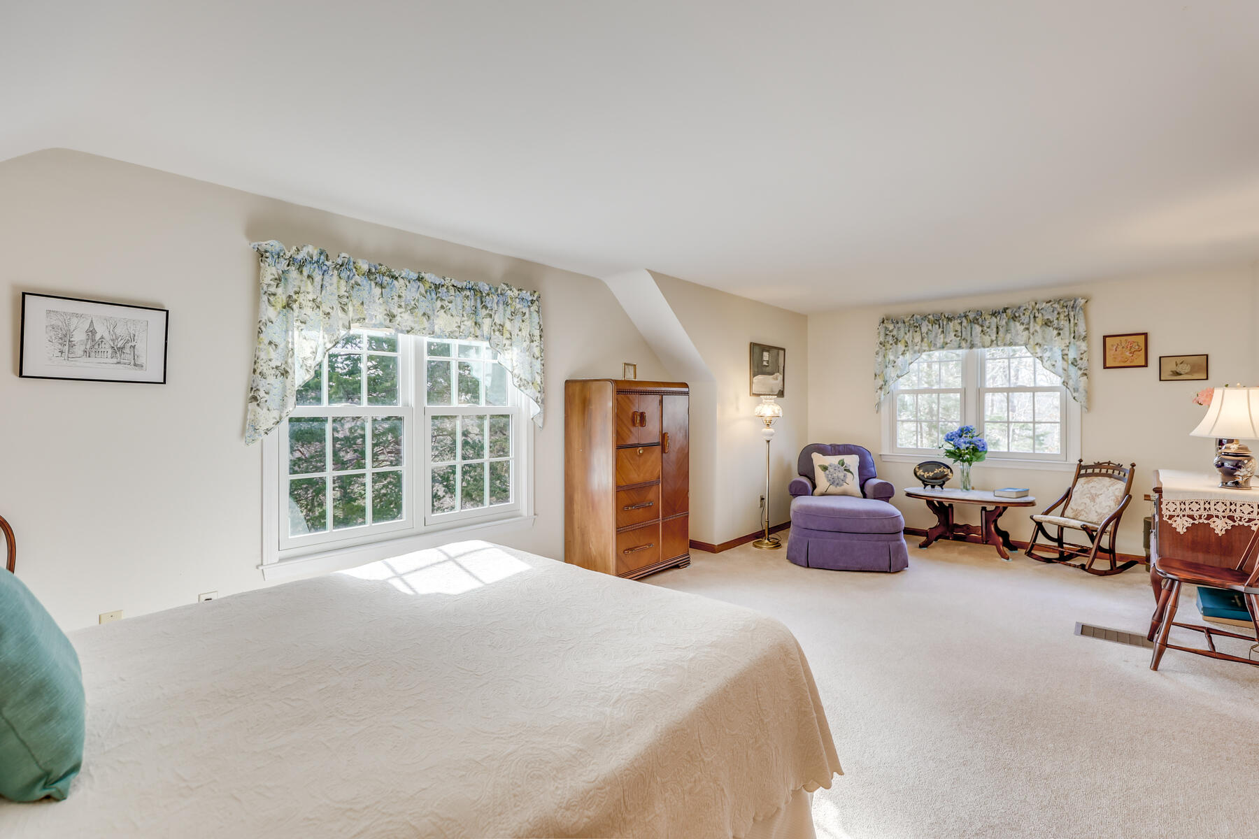 84 Beach Road Orleans, MA 02653 - Photo 20 of 45 a spacious bedroom with a bed and a large window