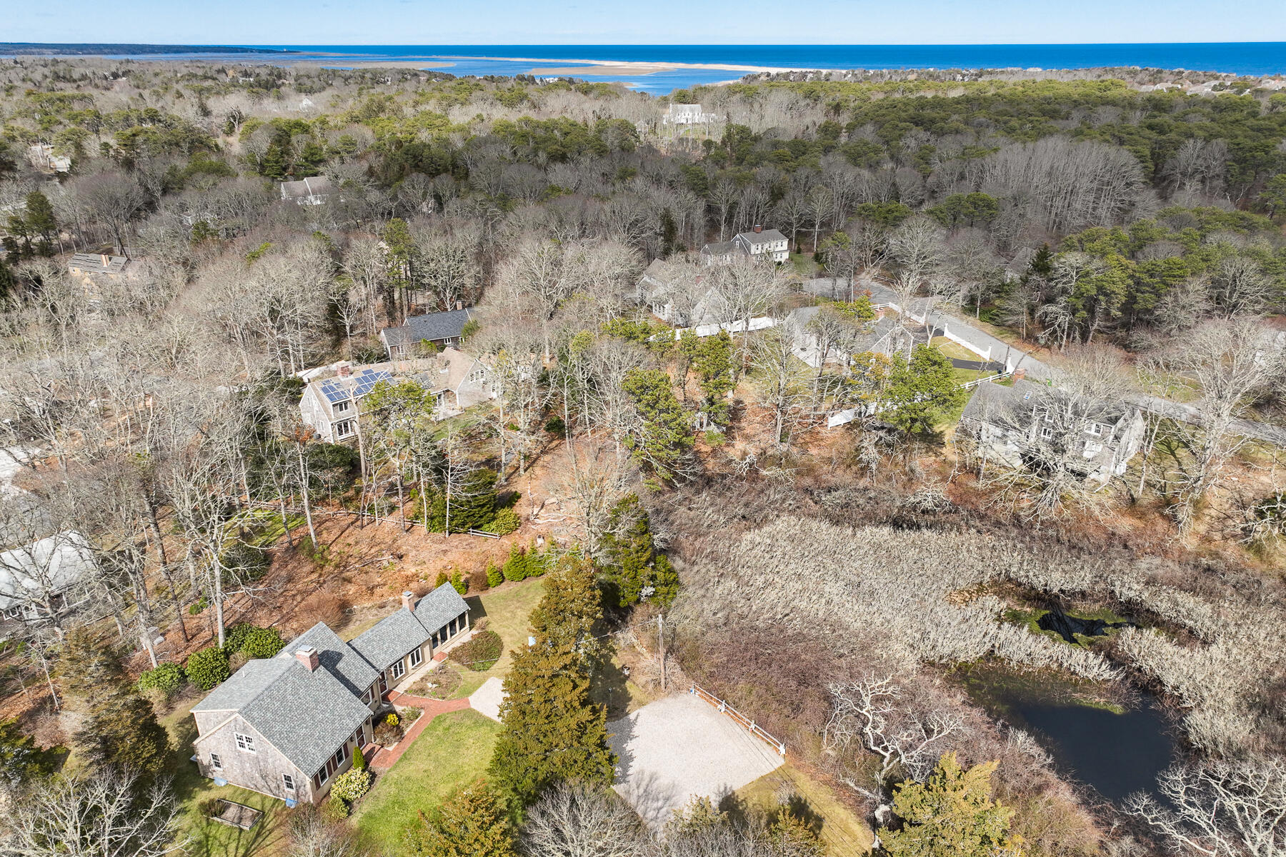 84 Beach Road Orleans, MA 02653 - Photo 2 of 45 a view of a yard with trees & house