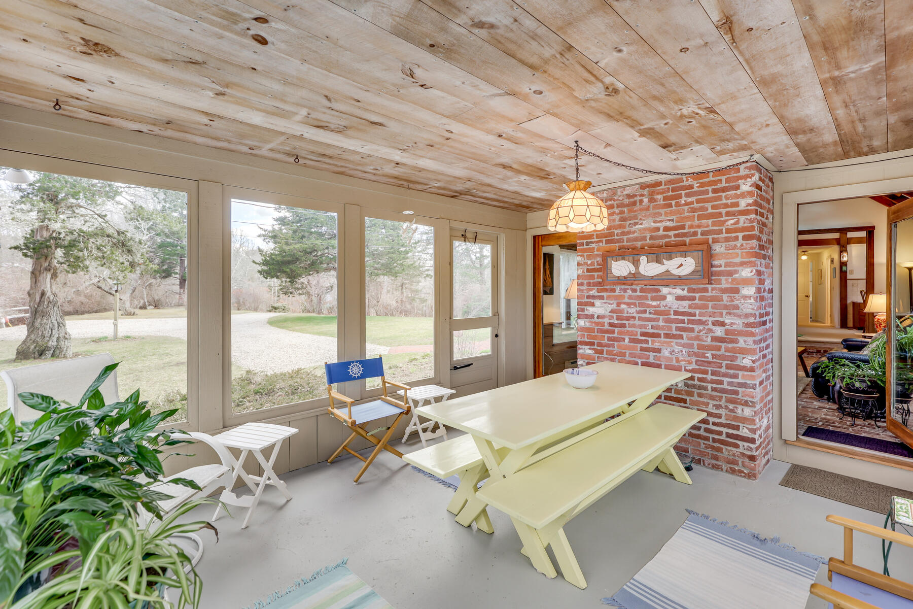 84 Beach Road Orleans, MA 02653 - Photo 26 of 45 a living room with patio furniture and a potted plant